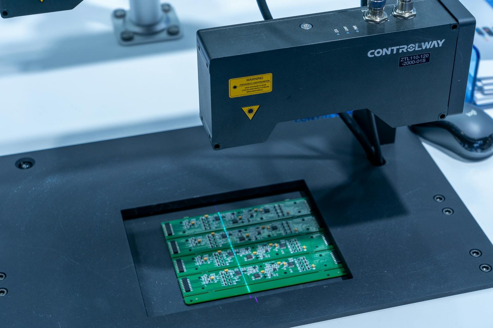 Close-up of a PCB inspection machine in action, highlighting technology.