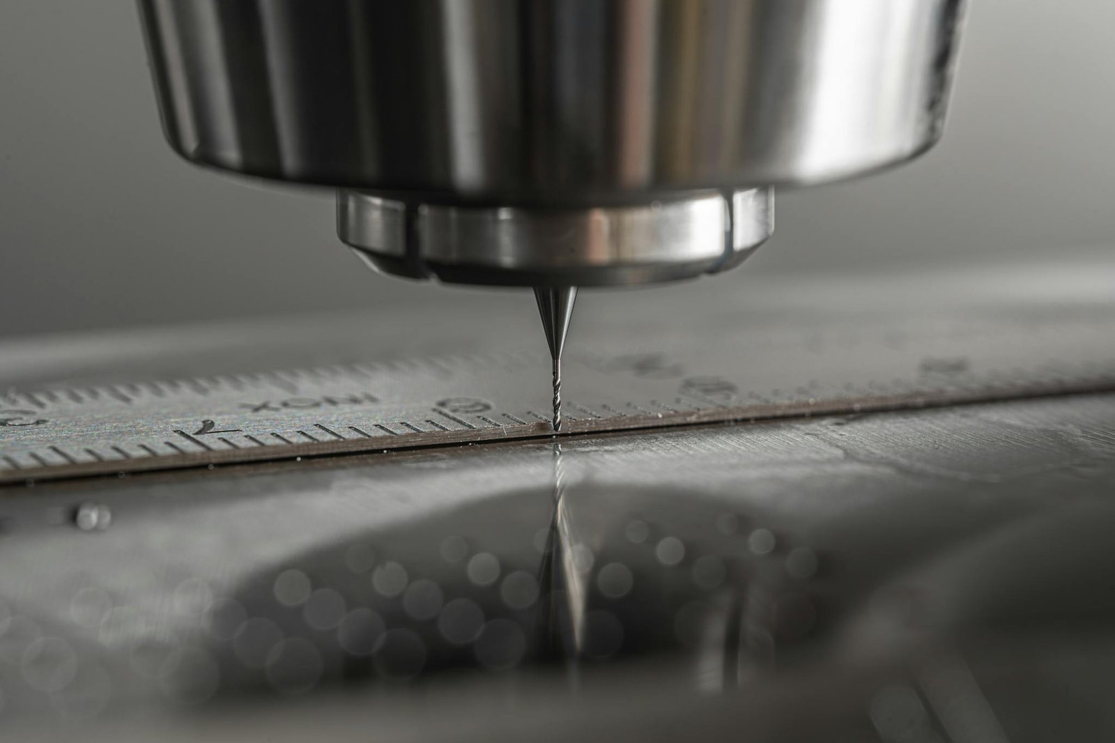Detailed close-up of a CNC milling machine working on metal, showcasing precision and industry technology.